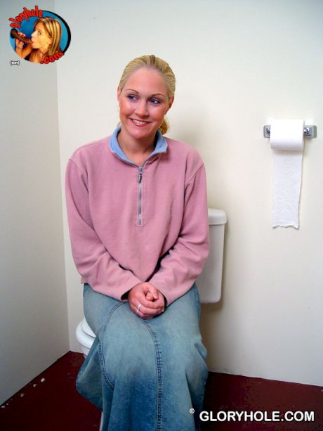 Blonde girl Jamie sits on the toilet and blows a black gloryhole dong