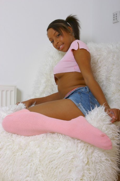 Ebony cutie Amy-Lou strips to her pink stockings & panties to show her boobs