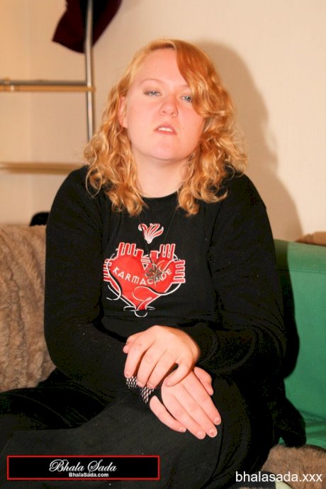 Redheaded fatty strips her sweatshirt and shows her cleavage in a black bra