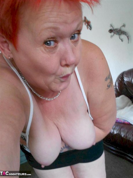 Older redhead Valgasmic Exposedabres her tits and twat while taking selfies