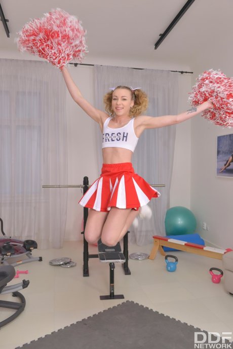 Cutie cheerleader Angel Emily in pigtails doffs uniform for three-way ass fuck