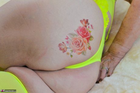 Blonde granny Sparkle looses her saggy tits from neon lingerie