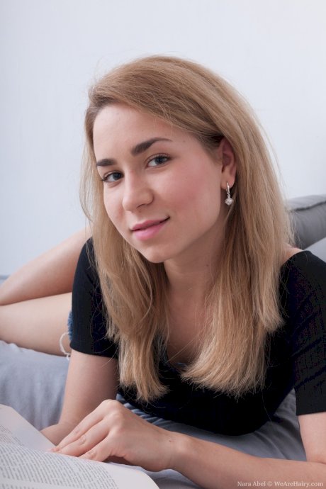 Amateur Russian Nara Abel gets naked & masturbates her hairy pussy on the bed