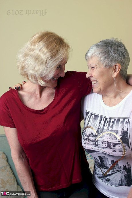 Old lesbians suck on each others boobs after modeling fully clothed