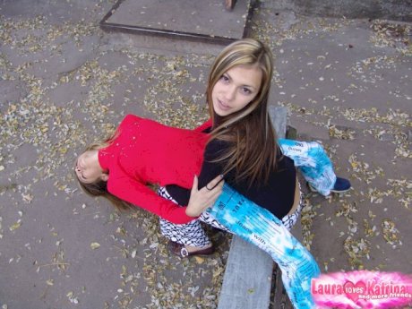 Young hot blonde lesbian teens having fun flashing their small tit in the sun