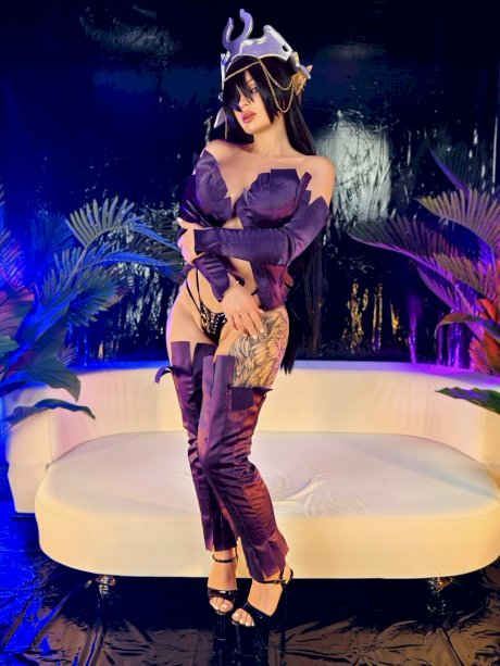 Solo beauty Sonya Vibe poses in a cosplay outfit before showing her big tits