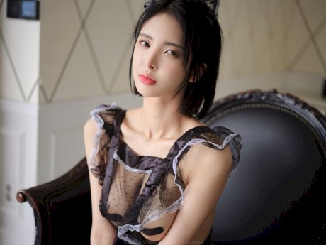 Sexy Korean babe teases with her body in a seductive sheer maid uniform