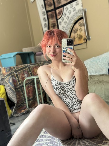 Pink-haired amateur slut Redhead Abby poses dressed up in the mirror