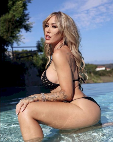 Blonde solo model Capri Cavanni takes self shots during non-nude action