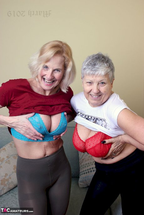 Old lesbians suck on each others boobs after modeling fully clothed