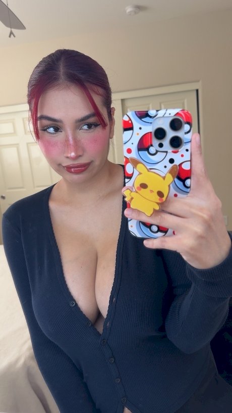 Redheaded honey Angel reveals her massive breasts and huge nips up close