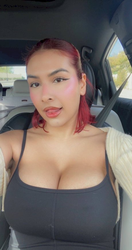 Buxom babe Angel takes selfies showing her big boobs & her trimmed pussy