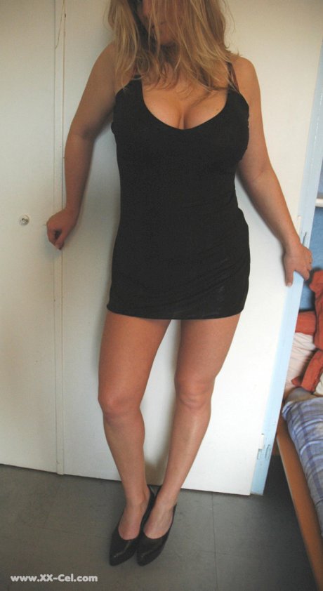 Beautiful amateur MILF in a black dress Zdenka K exposes her sexy legs and ass