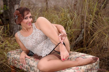 Mature pinup model Roni Ford kicks off pumps wearing retro lingerie in woods - Photo 14
