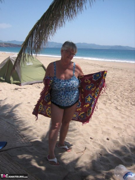 Fat granny Girdle Goddess takes off swimwear to pose nude at the ebach