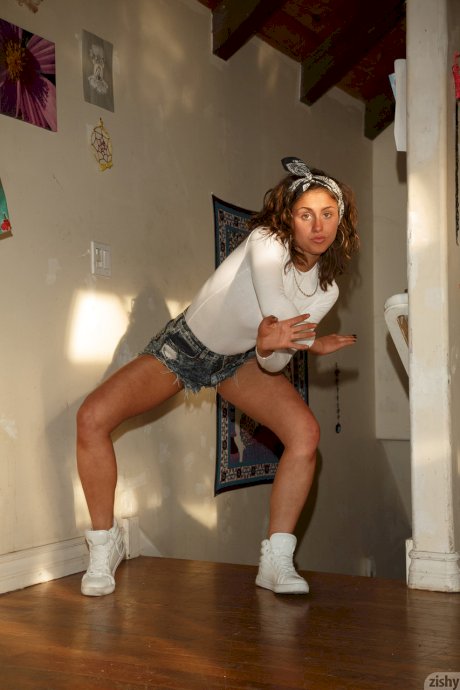 Hot amateur babe Sonya Ash loses her jean shorts & poses in her bodysuit