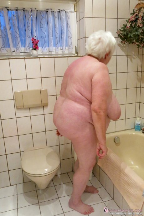 Naughty granny Neebana shows her chubby body while completely naked