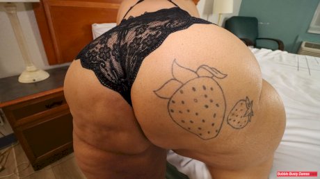 SSBBW Strawberrys Delight shows her massive ass in black lingerie