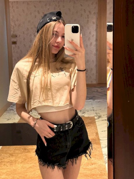 Amateur girl with long hair takes selfies in a variety of outfits porn pics