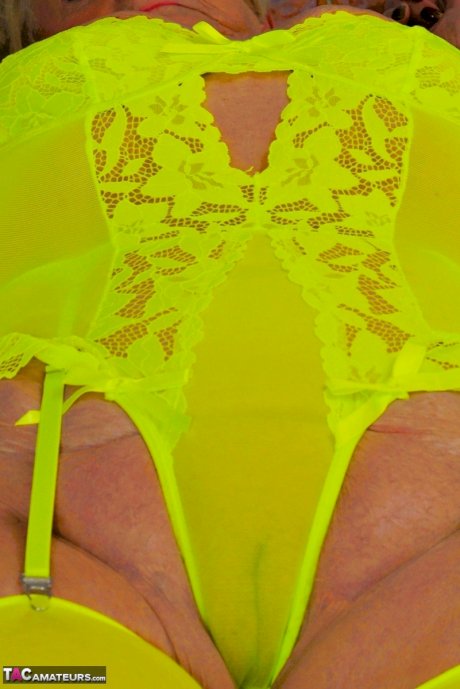 Blonde granny Sparkle looses her saggy tits from neon lingerie