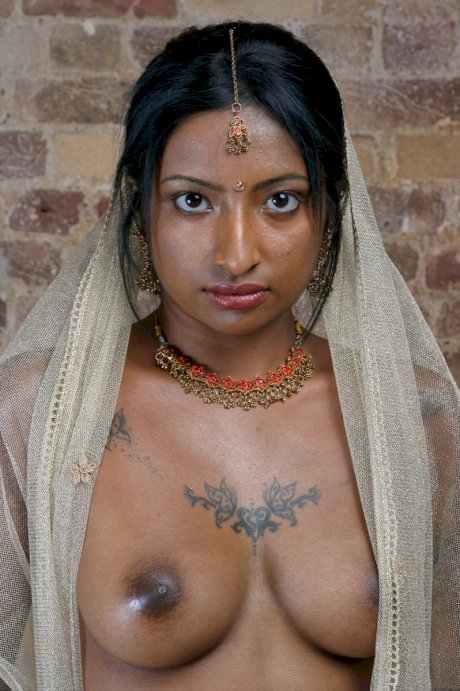 Indian model with tattoos exposes her firm tits in traditional clothing