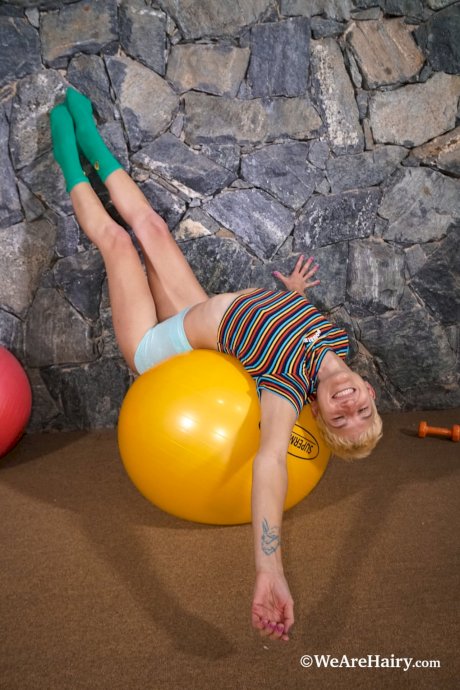 Short-haired amateur Gloria M strips during her workout & shows her hairy cunt - Photo 3