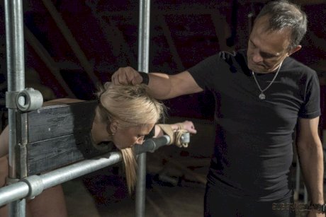 Blond sex slave Roxy Risingstar find herself being tortured while in bondage