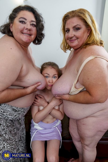 Chubby grannies Edina & Jana envelope a young maid's head with their big tits - Photo 13