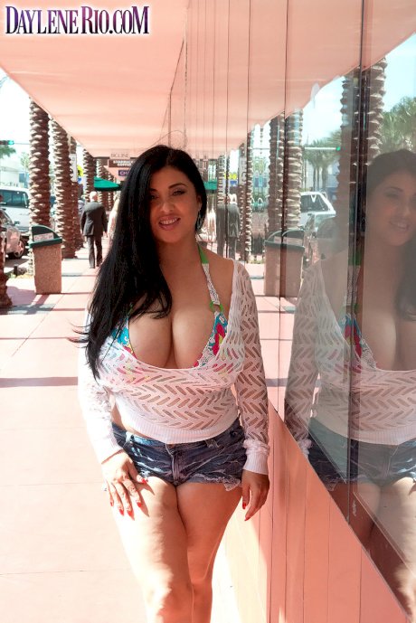 Latina female Daylene Rio releases her massive tits from bikini top