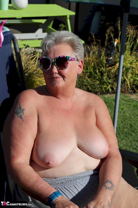 Fat nan Valgasmic Exposed shows her tits and snatch on a backyard lounge chair