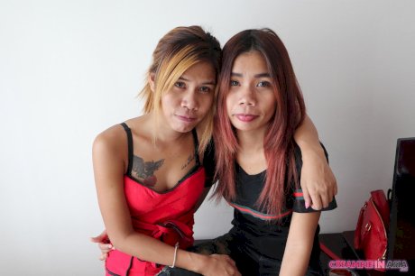 Kinky Asian babes Kuai & Jem tease with their inked bodies together