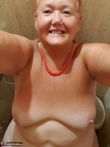 Fat granny with red hair Valgasmic Exposed takes naked selfies at home