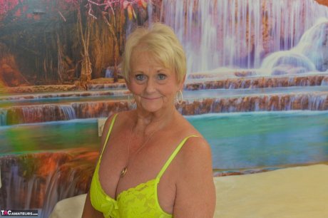 Blonde granny Sparkle looses her saggy tits from neon lingerie